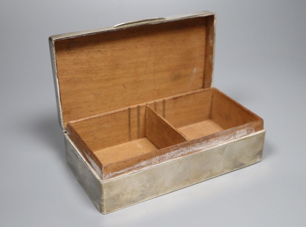 A George V silver mounted rectangular cigarette box, 16.3cm, gross 14oz.